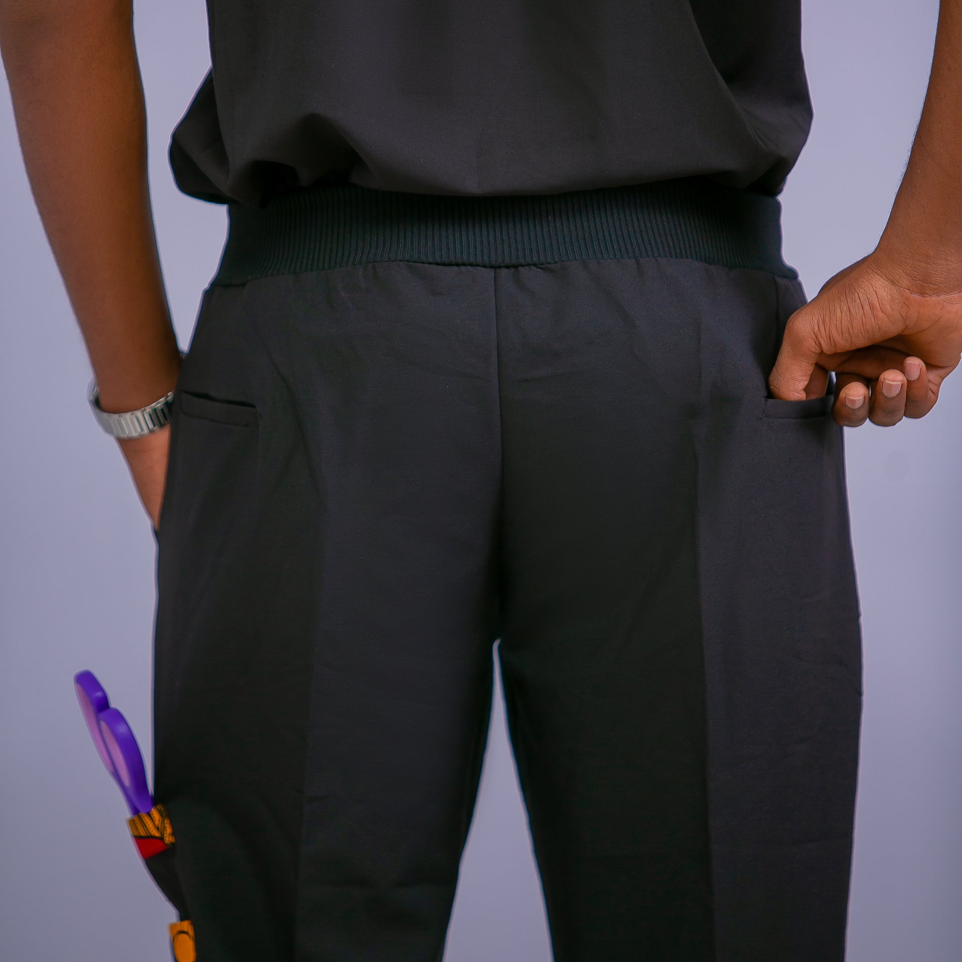 Person wearing BAJI Scrubs Black Pants with a plain background