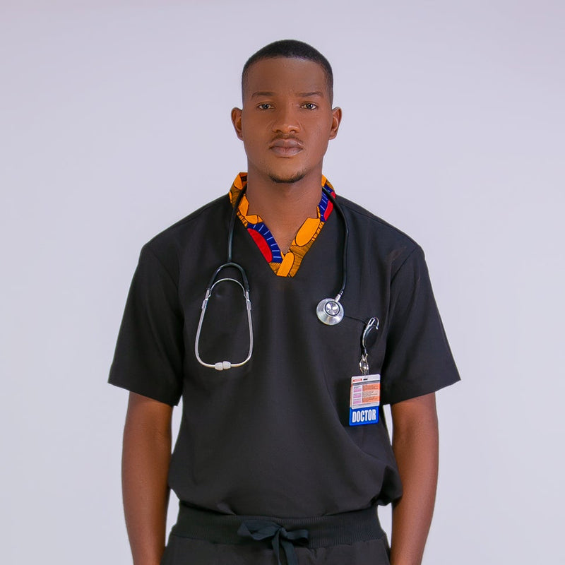 Person wearing black medical scrubs with colorful accents on a white background