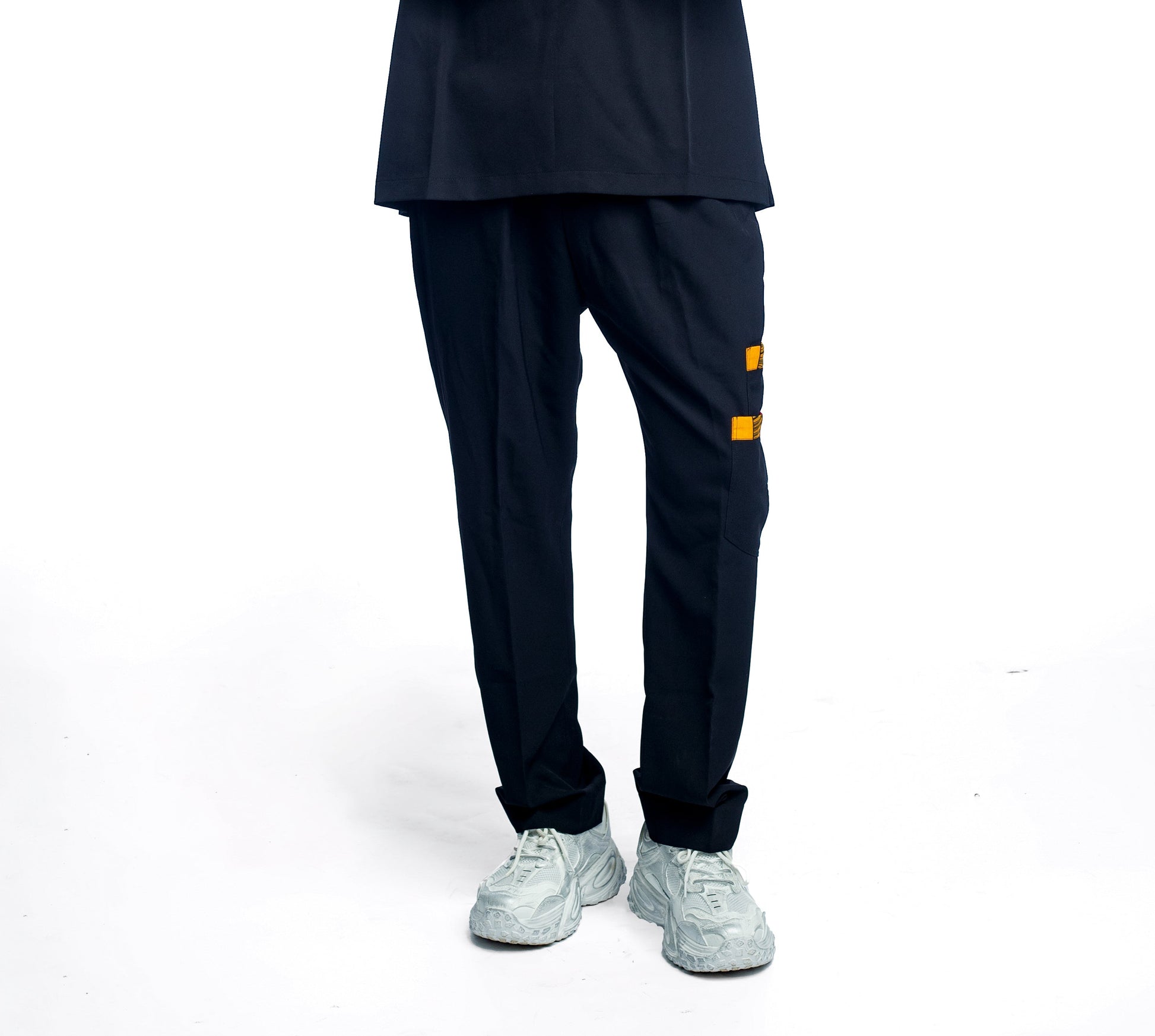 Person wearing a medical outfit scrub pant on a white background
