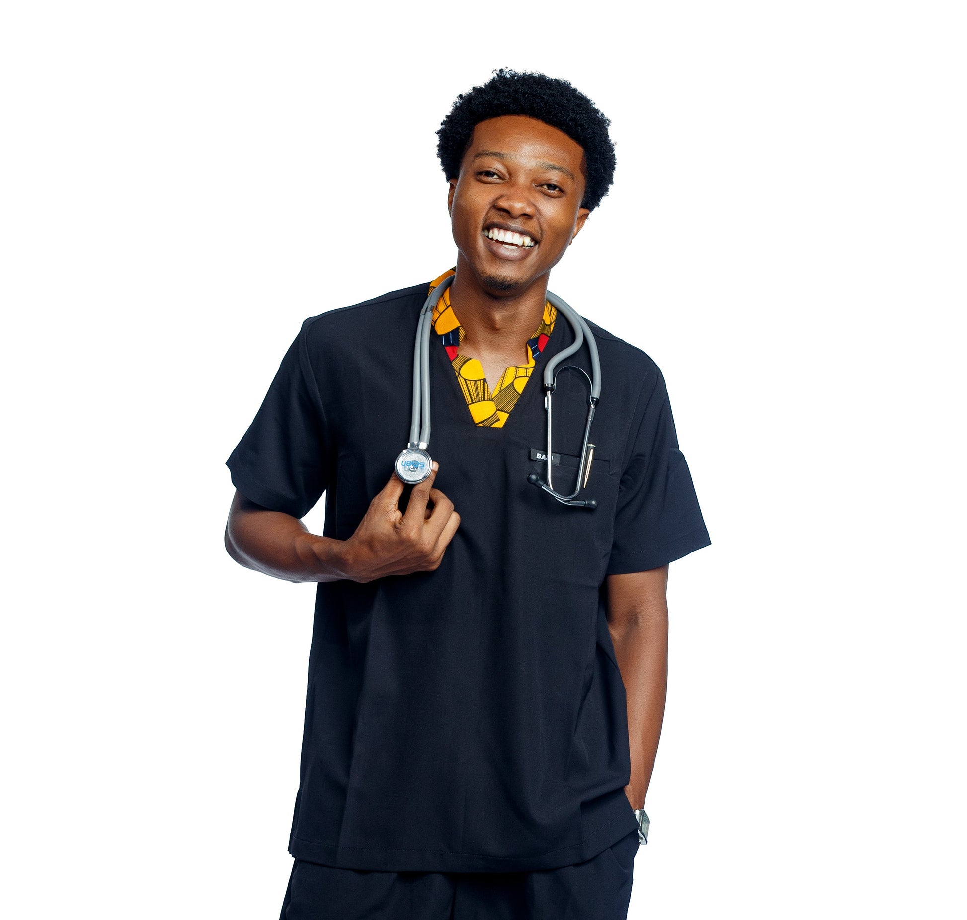 Person wearing a black medical scrub set with a stethoscope on a white background