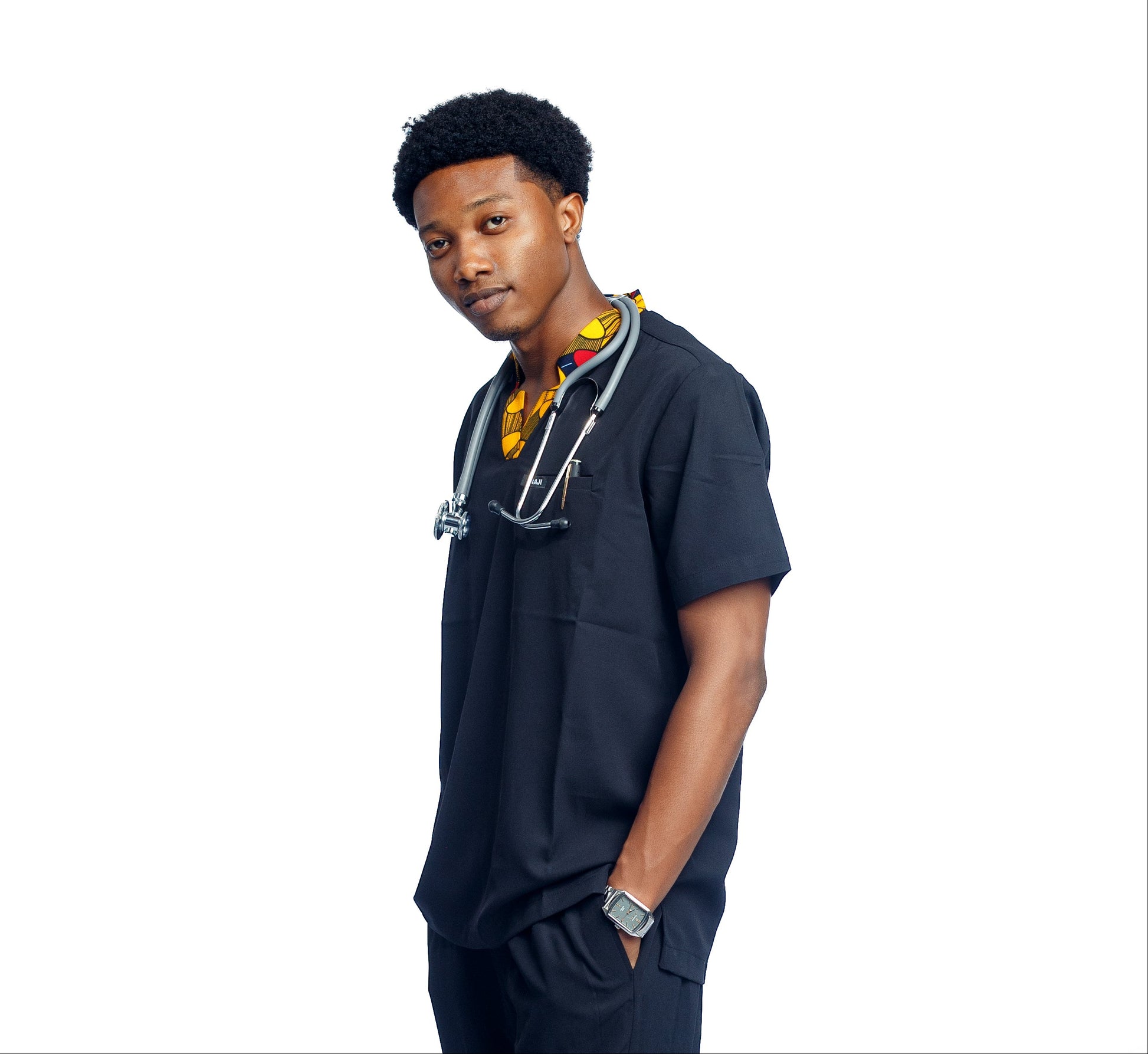 Person wearing a medical scrub top with a stethoscope on a white background